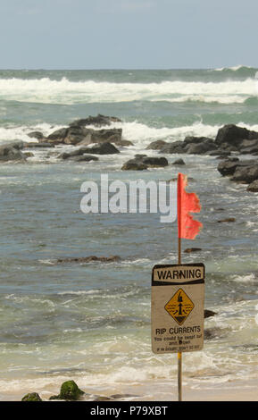Warning. Rip Currents. Sign. Beach scene. Turtle Beach, Laniakea Beach, Oahu Island, Hawaii, USA. Stock Photo