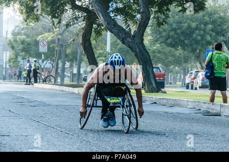 Lima, Peru - May 20th 2018: Marathon Lima 42k, sporting event that gathers athletes from all over the world. Athlete in a wheelchair. Stock Photo