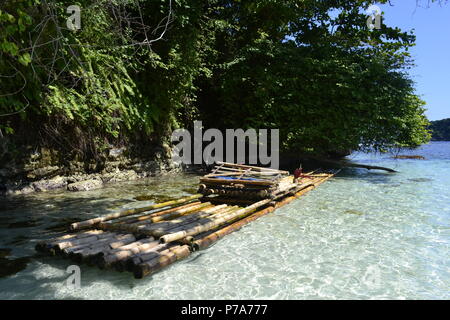 crystal water jamaica beach with bamboo raft Stock Photo
