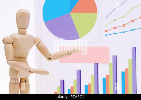 Wooden dummy with color chart printed documents Stock Photo
