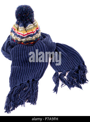 Blue winter bobble hat and matching scarf with tassels or fringe isolated against a white background Stock Photo