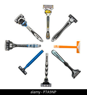 Winneconne, WI - 4 July 2018: A collection of different brands disposable shaving razors including Gillette, Bic and Shick on an isolated background. Stock Photo