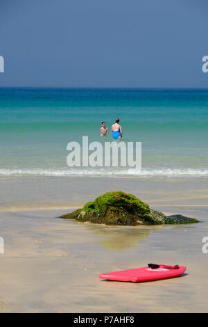 St Ives, UK. 5th July 2018. UK Weather. After a misty start to the day the sun broke through and it was  a warm sunny day in Cornwall on Porthmeor Beach. Credit: Paul Melling/Alamy Live News Stock Photo