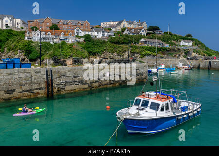 Newquay, UK. 5th July 2018. UK Weather - The heatwave continues and the popular holiday resort of Newquay in North Cornwall  is bathed in sunshine as the little fishing boats and pleasure craft use the harbour on a hot summer afternoon. Credit: Terry Mathews/Alamy Live News Stock Photo