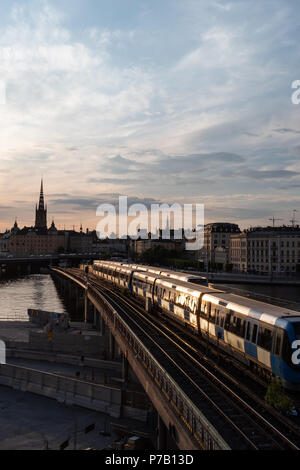 Stockholm waterfront and Riddarholm Church, seen from Sodermalm, Stockholm, Sweden at sunset Stock Photo