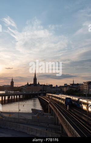Stockholm waterfront and Riddarholm Church, seen from Sodermalm, Stockholm, Sweden at sunset Stock Photo