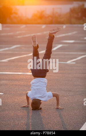 The boy standing upside down  Stock Photo
