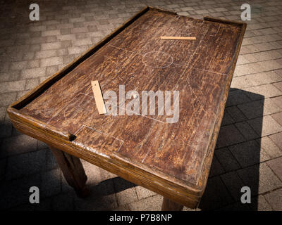 Old wooden table for playing table football, markings of matchfield and rulers Stock Photo