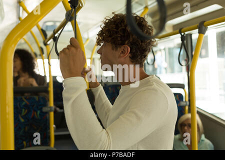 Young man travelling in the bus Stock Photo