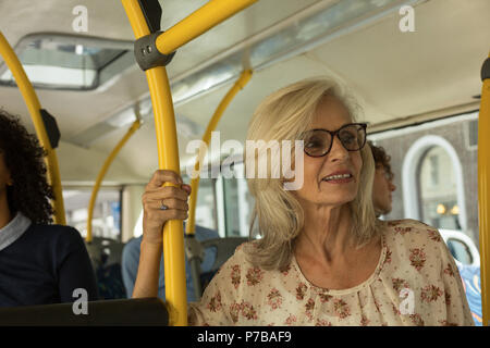 Senior woman travelling in the bus Stock Photo