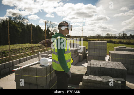 Engineer using VR headset at the construction site Stock Photo