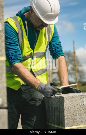 Engineer using digital tablet at the construction site Stock Photo