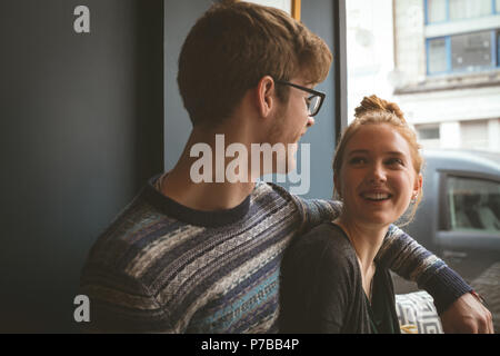 Couple talking to each other in the cafe Stock Photo