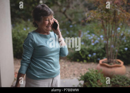 Senior woman talking on a mobile phone Stock Photo