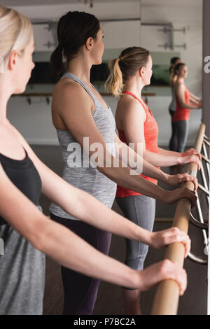 Group of women standing holding the barre Stock Photo