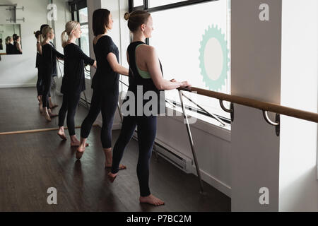 Group of women standing holding the barre Stock Photo
