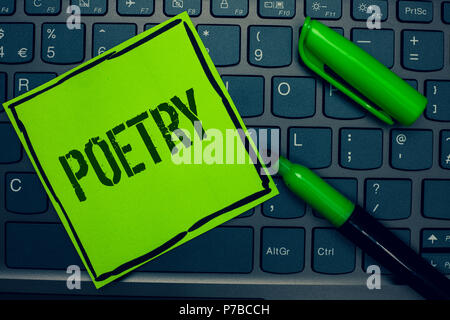 Conceptual hand writing showing Poetry. Business photo text Literary work Expression of feelings ideas with rhythm Poems writing Keyboard sticky card  Stock Photo