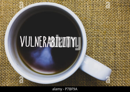 Handwriting text writing Vulnerability. Concept meaning Information susceptibility systems bug exploitation attacker Mug coffee thoughts ideas creativ Stock Photo