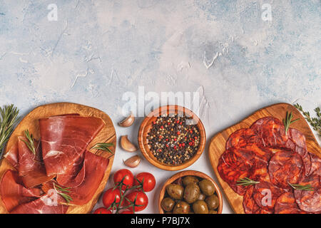 Spanish tapas with  chorizo,  jamon, picnic table, top view. Stock Photo