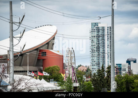 Calgary, Alberta Canada - July 02 2018 - Setting up for the 2018 Calgary stampede with Calgary Skyline In The Background Stock Photo