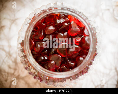Gummy candy with red heart shapes in a glass Stock Photo