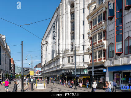 Shoppers milling outside a Debenhams Department store in Market Street, Manchester, UK Stock Photo