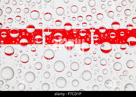 Flags  of Indonesia behind a glass covered with raindrops. 3D illustration Stock Photo