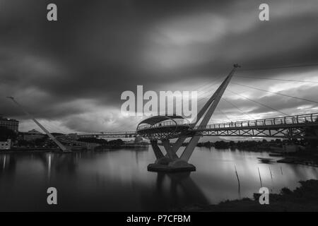 Darul Hana Bridge (Jambatan Darul Hana) is best known as the golden bridge built across the Sarawak river. Stock Photo