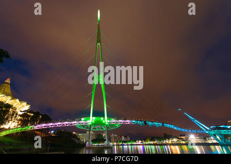 Darul Hana Bridge (Jambatan Darul Hana) is best known as the golden bridge built across the Sarawak river. Stock Photo