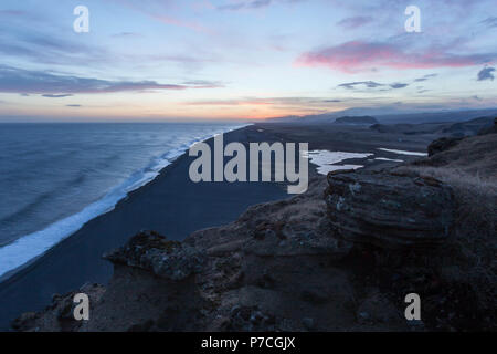 The beach looking west from Dyrhólaey at dusk, Iceland Stock Photo