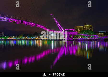 Darul Hana Bridge (Jambatan Darul Hana) is best known as the golden bridge built across the Sarawak river. Stock Photo