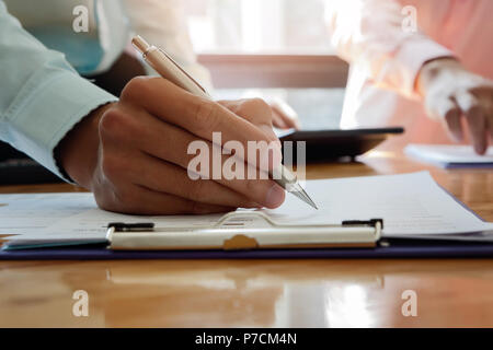 Businessman writing or pointing on report paper. Business strategy concept. Stock Photo