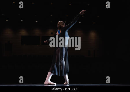 Ballet dancer dancing on stage Stock Photo