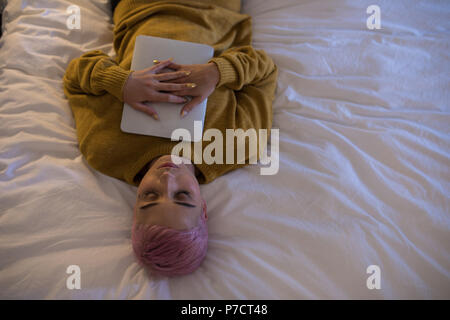 Woman sleeping in bedroom at home Stock Photo