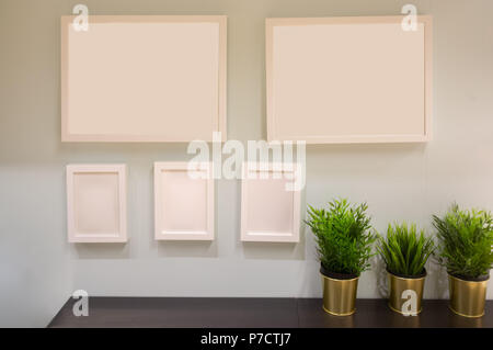 Five picture frames arranged on a wall with copy space Stock Photo