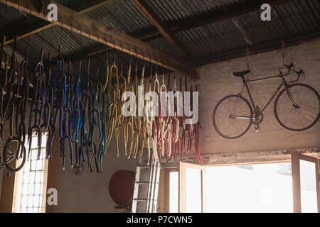 Bicycle and bicycle parts in workshop Stock Photo