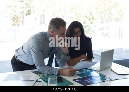 Business colleagues discussing over document Stock Photo