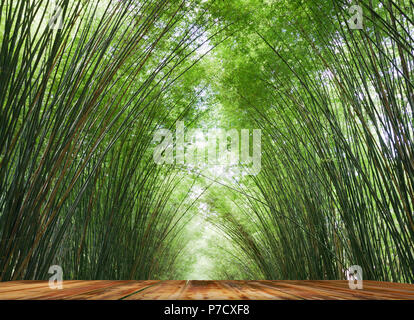 A wooden balcony that protrudes into a curved bamboo forest. Background and texture of beautiful in nature Stock Photo