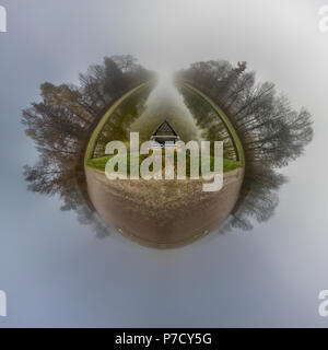 Autumn Little Planet in the forest with fog Stock Photo