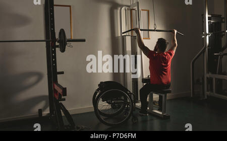 Handicapped man working out lat pulldown training Stock Photo