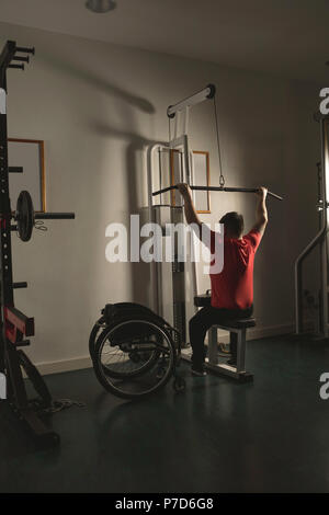Handicapped man working out lat pulldown training Stock Photo