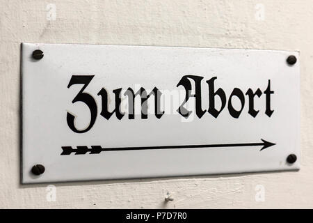 Old enamel sign: Zum Abort, Bavarian Railway Museum Nördlingen, Nördlingen, Bavaria, Germany Stock Photo