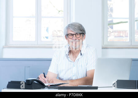 Man working at the laptop in the office Stock Photo