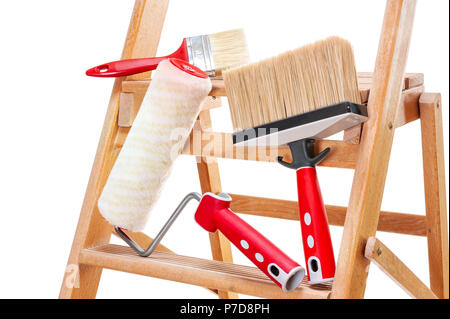 Work tools for professional house painter on a wooden ladder, isolated on white background Stock Photo