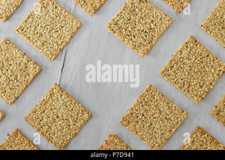 Frame of set fitness cookies with chia seeds, flax and pumpkin on white wooden background, top view. Healthy food Stock Photo