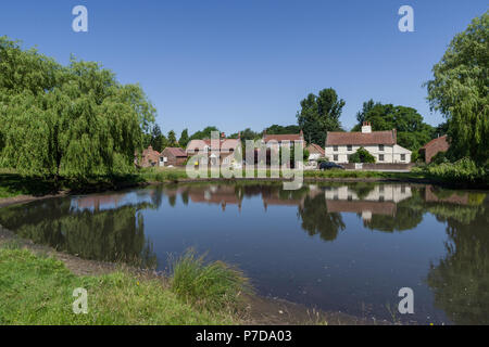 A view across the duck pond in the picture postcard village of Nun Monkton; North Yorkshire, UK Stock Photo