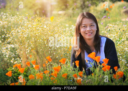 One Beautiful happy asian woman in the flowers garden. Stock Photo
