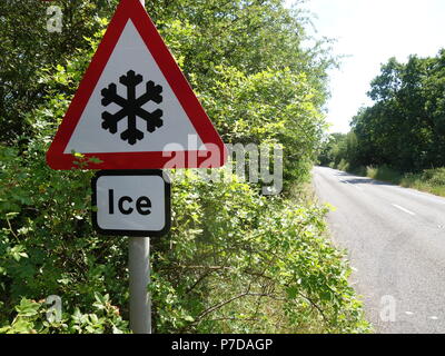 Warning Ice Sign that is mounted permanently on a pole at the side of a busy road outside Rotherham Stock Photo