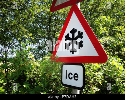 Warning Ice Sign that is mounted permanently on a pole at the side of a busy road outside Rotherham Stock Photo