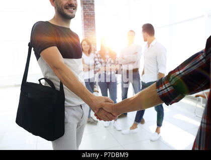 handshake between the designer and the client Stock Photo